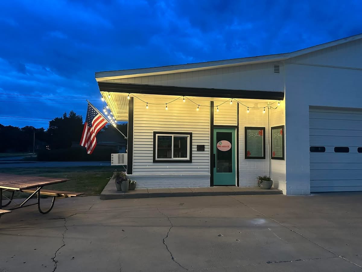 The Sno Shack at dusk on Main Street, string lights on